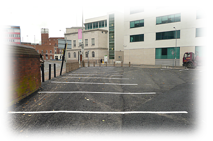 a photo of an open asphalt air car park